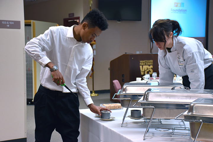 Culinary Arts students set up for the patron tour