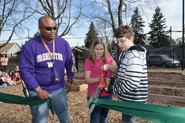 Principal Kirsten Copeland and students cut the ribbon on their new garden