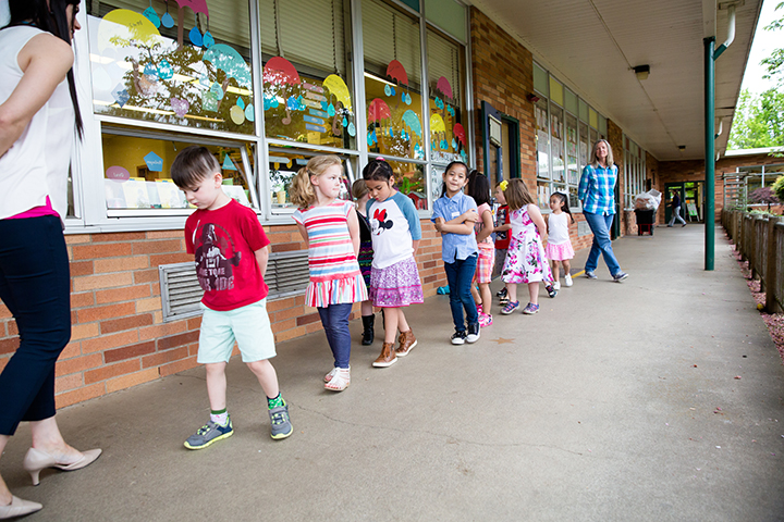 Students practice walking in a line during a preschool program at Marshall Elementary