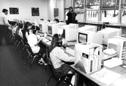 Students working on computers in a classroom.
