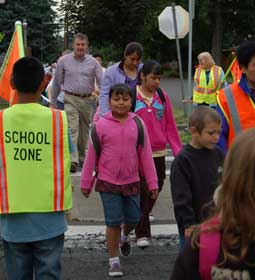 Washington Elementary School starts the walking school bus program. Students walk to their designated bu stops and wait for a group of students, volunteers and parents to walk them to school safely.