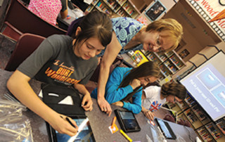 Students at Alki Middle School are using iPads in the classroom.