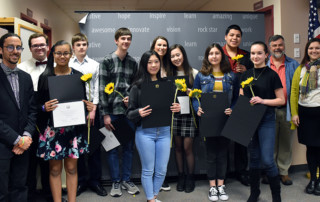 student musicians and their teachers accept their award