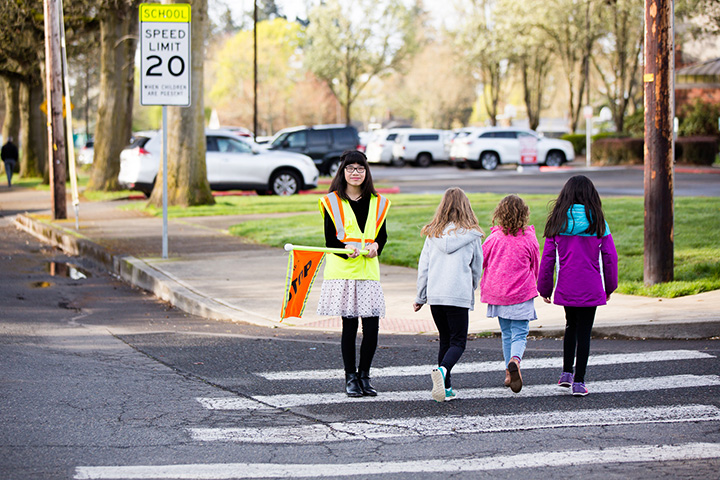 Safety patrol helps students cross the street