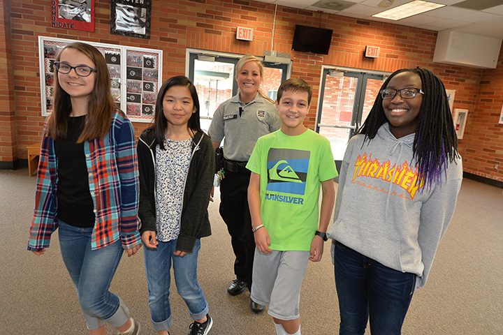 Students and district resource officer at Jason Lee Middle School