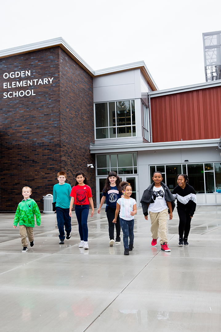 Students in front of their new school building