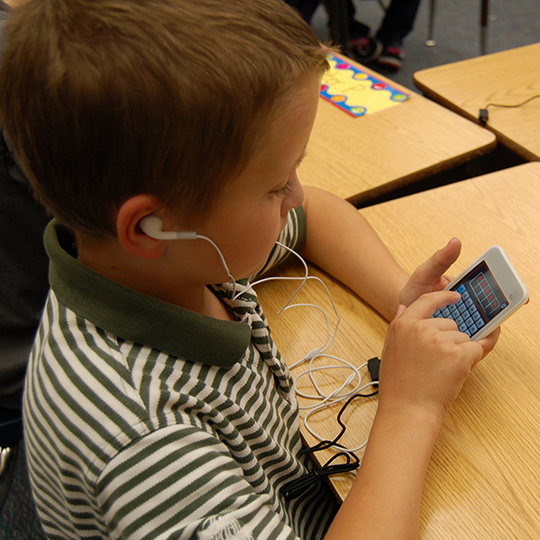 King elementary student working with an ipod