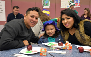 Family enjoys breakfast together at Chinook Elementary School