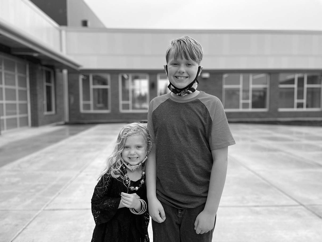 two students posed in front of Walnut Grove Elementary