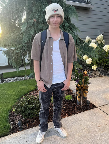 Student poses for a first day of school photo