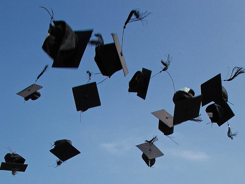 Graduation caps tossed up into the sky