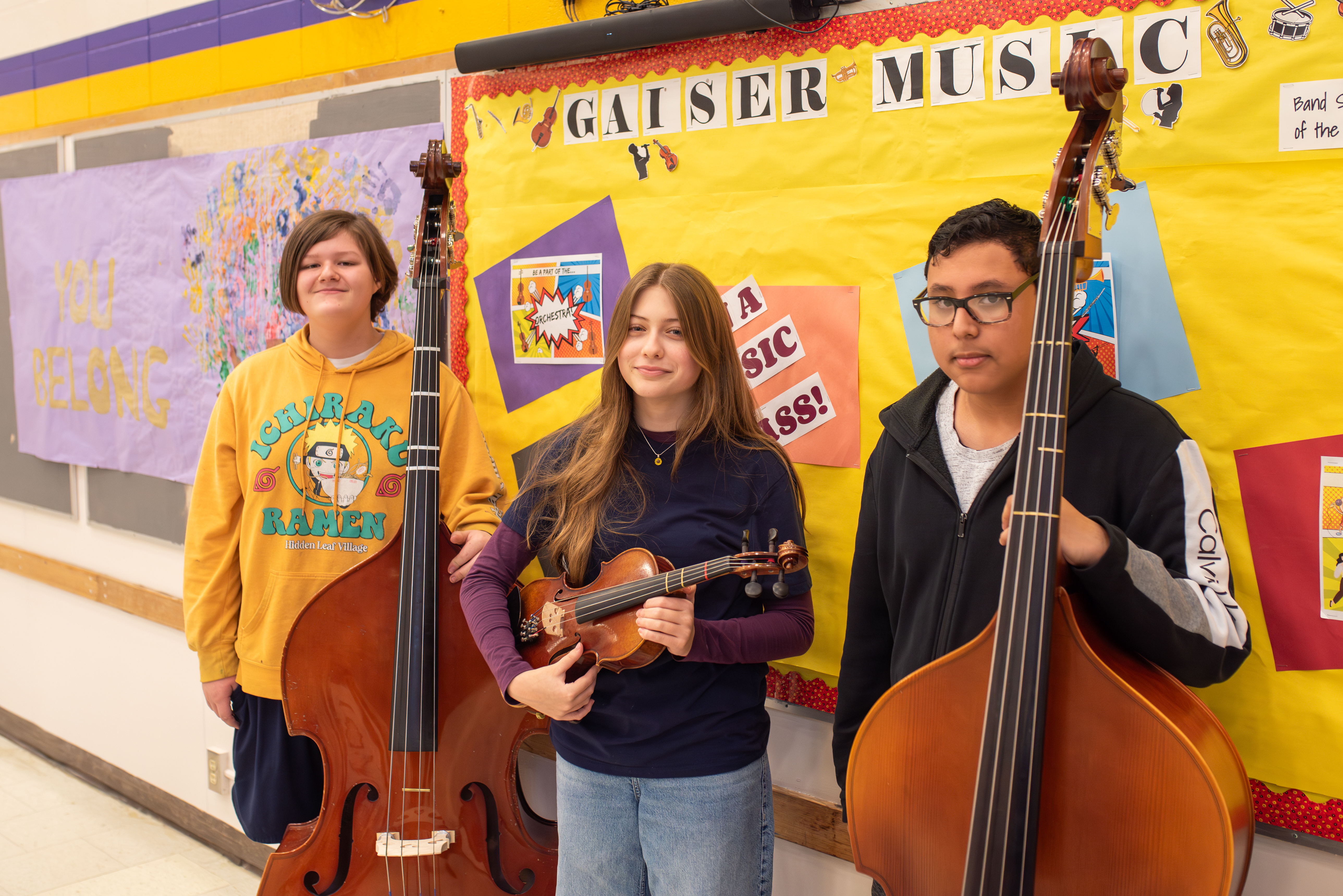Three students from Gaiser Middle School pose with their instruments.