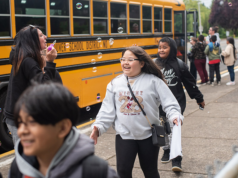 Students getting on and off the bus!