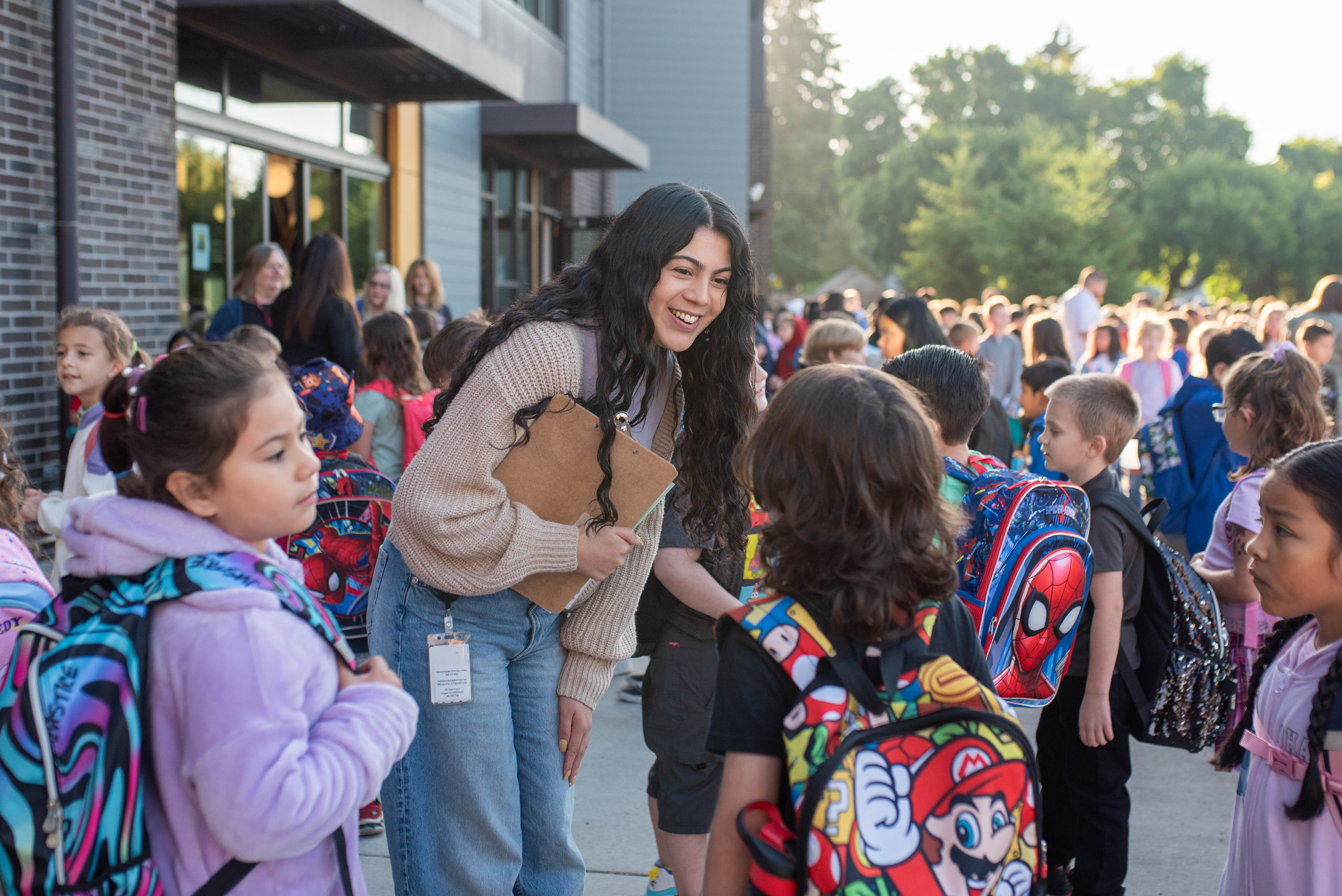 First Day of School 2024_King-9 First Day of School 2024 photo. Teacher greeting students!