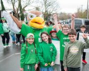 Hough parade Hawk mascot and students